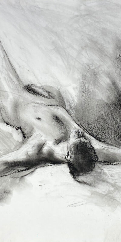 charcoal drawing of male model laying