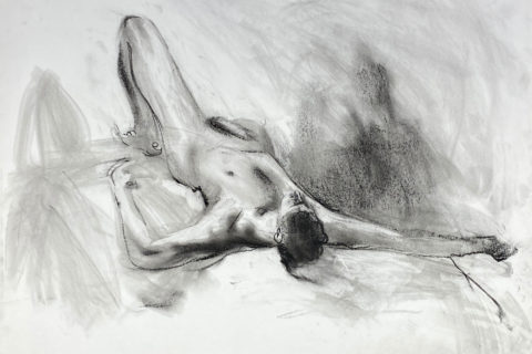 charcoal drawing of male model laying