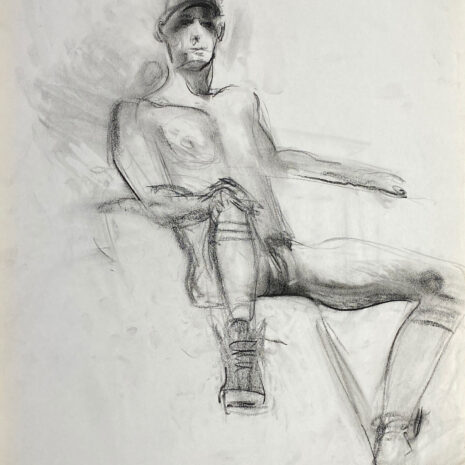 charcoal drawing of nude male model sitting in sneakers, gaiters & baseball cap