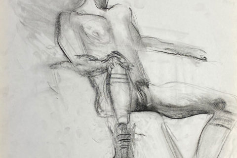 charcoal drawing of nude male model sitting in sneakers, gaiters & baseball cap